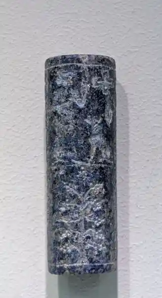 The Kassite seal from Babylon, only a small part of the surface is decorated with figures; the largest space is occupied by prayer